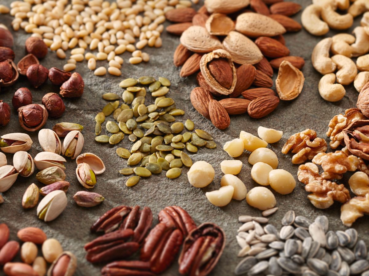 An assortment of nuts and seeds on a table