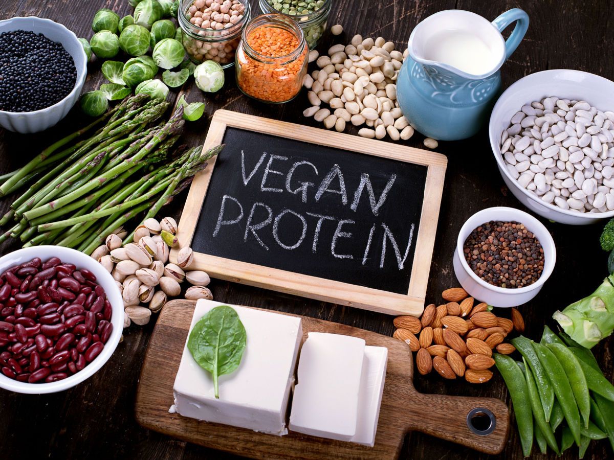 Vegan protein sources including beans, almonds, and soy milk