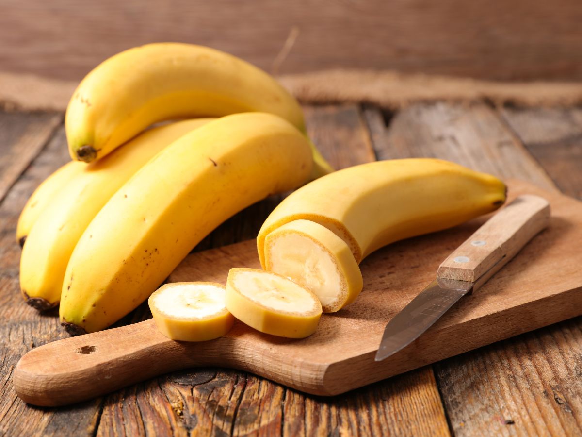Bananas on a wooden cutting board