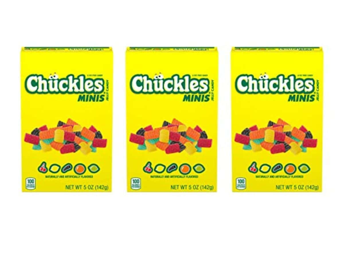 Three bright yellow boxes of Chuckles jelly candy.