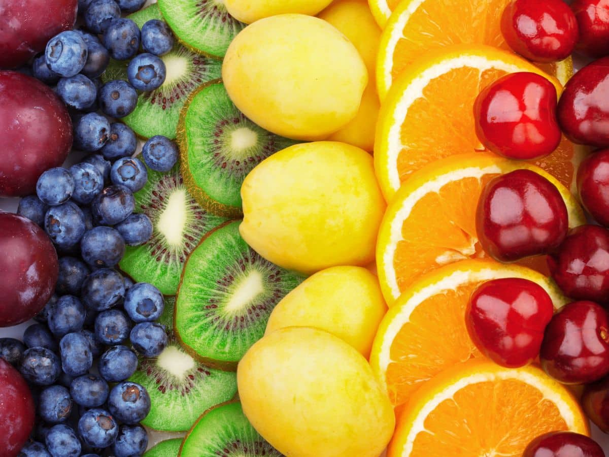 A rainbow-colored assortment of fresh fruit.