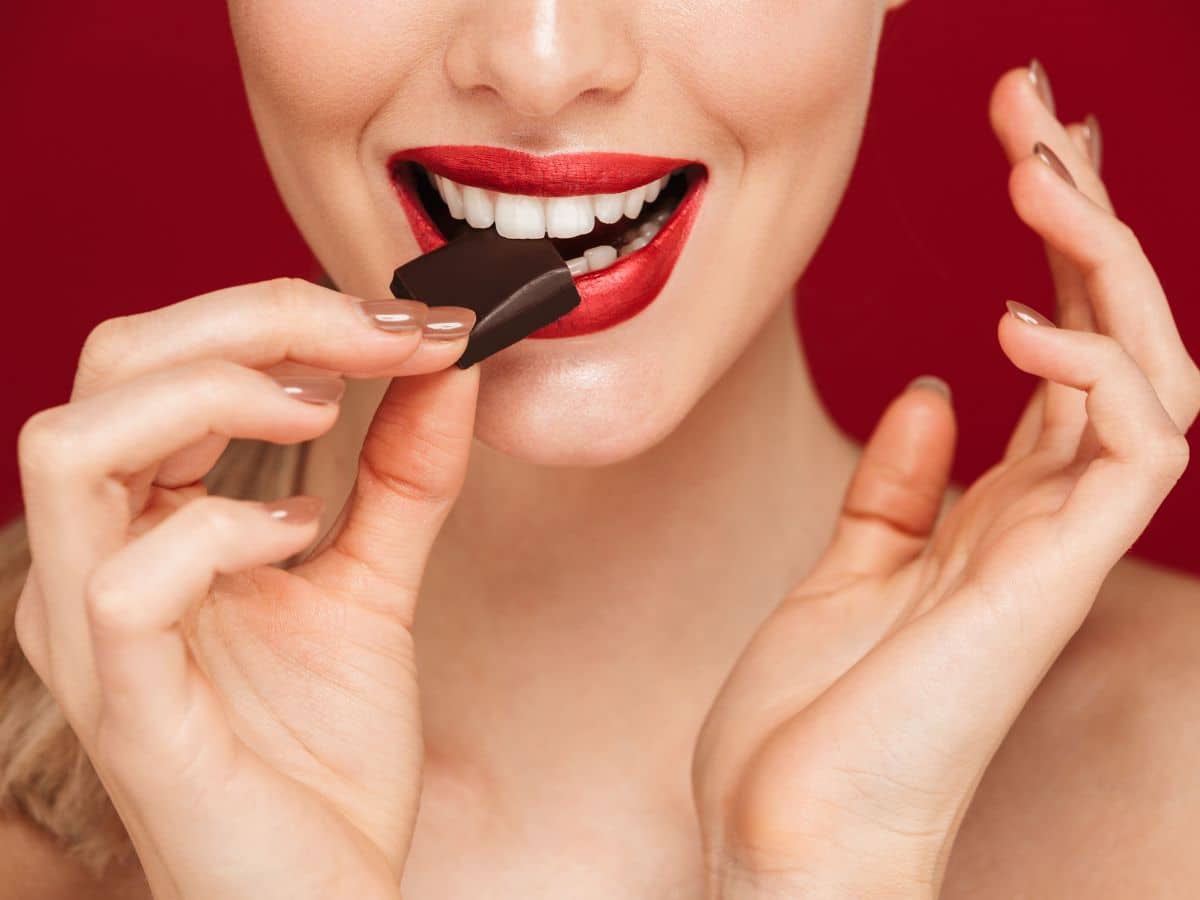 Woman Eating a Piece of Chocolate