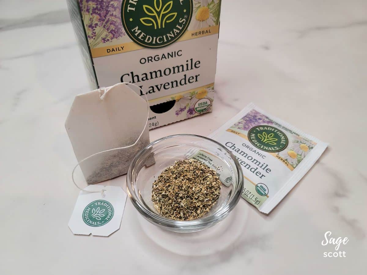A box of chamomile lavender tea with tea bags and loose tea in a small bowl
