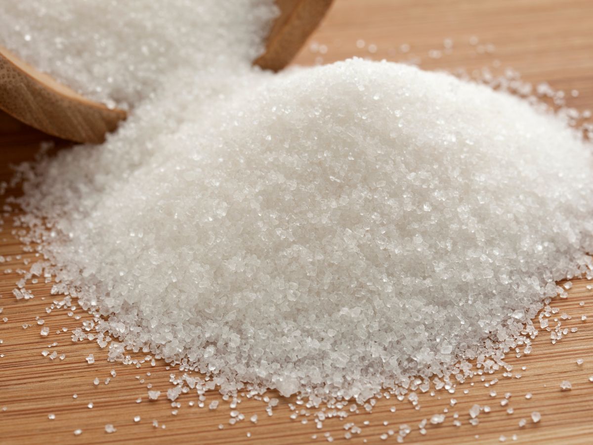 Pile of Granulated Sugar on Wooden Counter