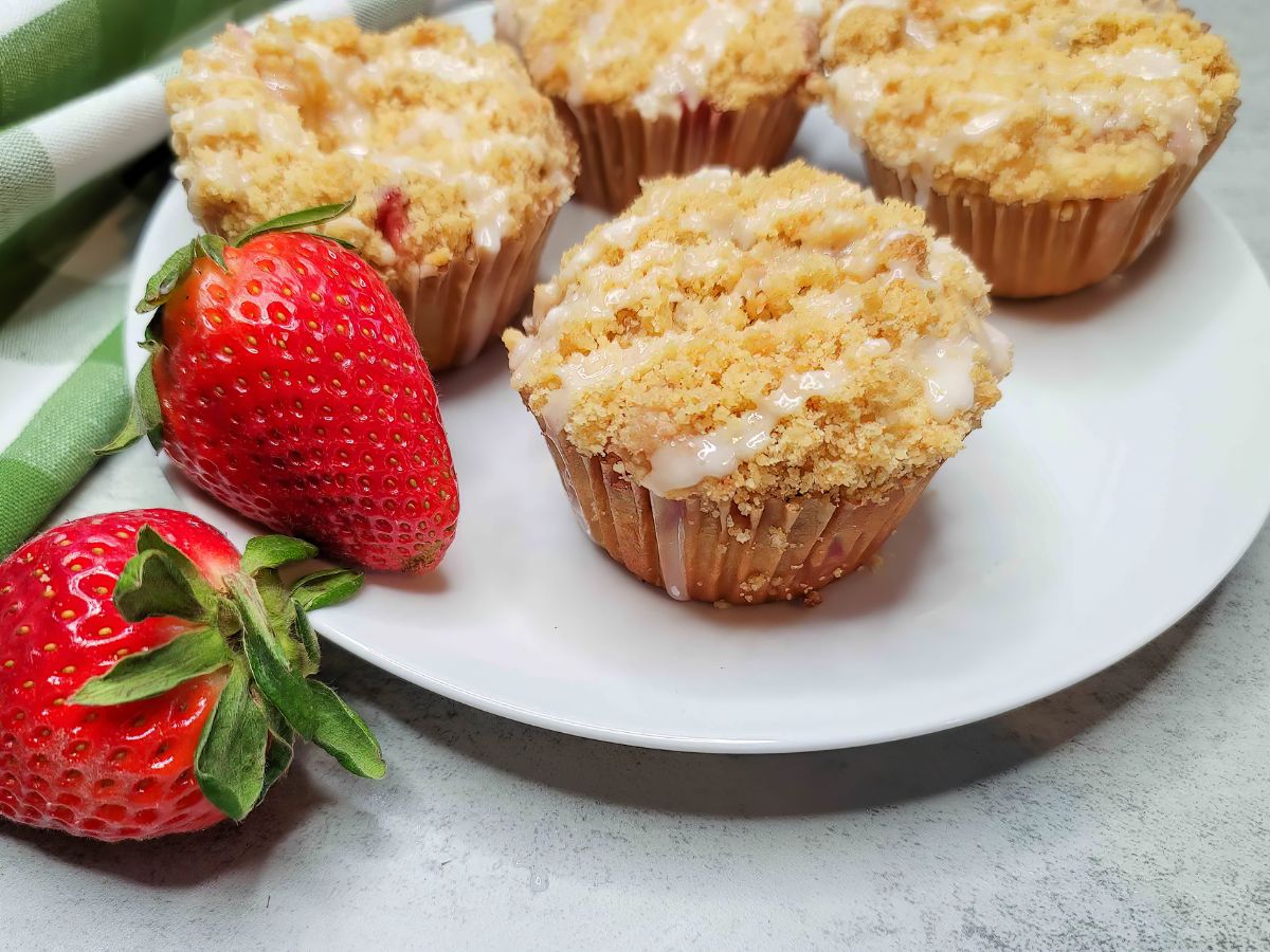 Strawberry Cream Cheese Muffins on a Plate with Fresh Strawberries