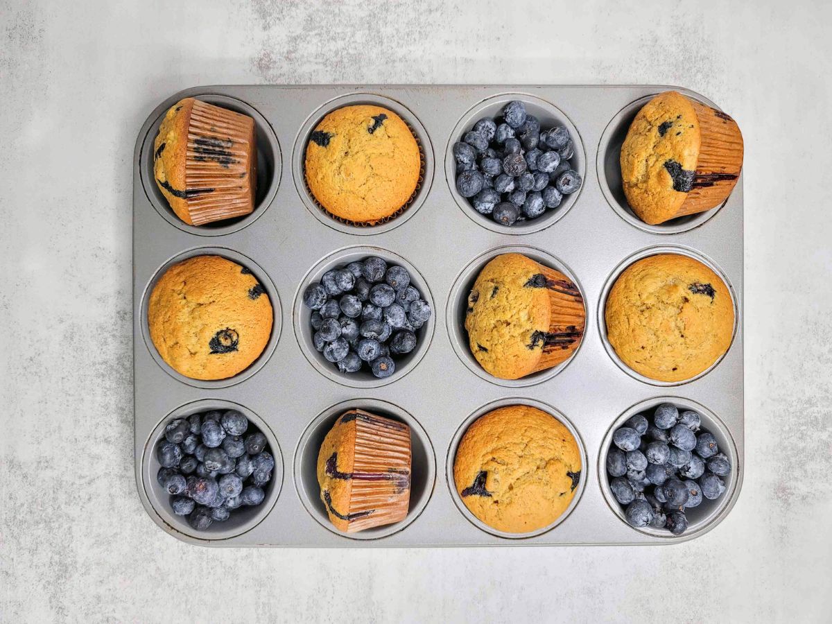 Banana blueberry muffins in a muffin tin.