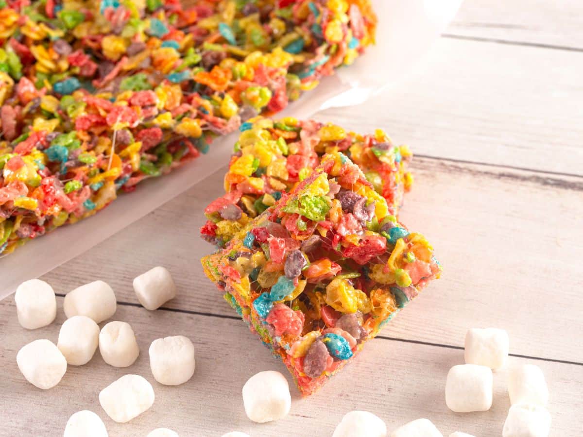 Fruity Pebbles squares on a table with miniature marshmallows