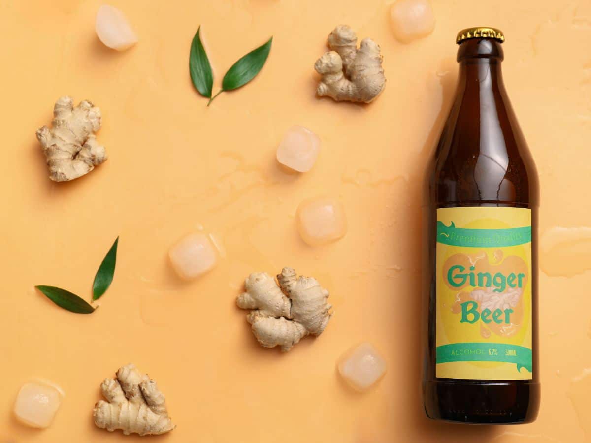 A bottle of ginger beer against a yellow background