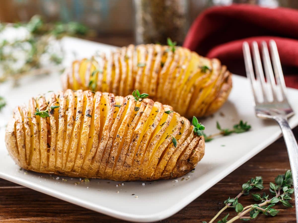 A plate of Hasselback potatoes sprinkled with thyme