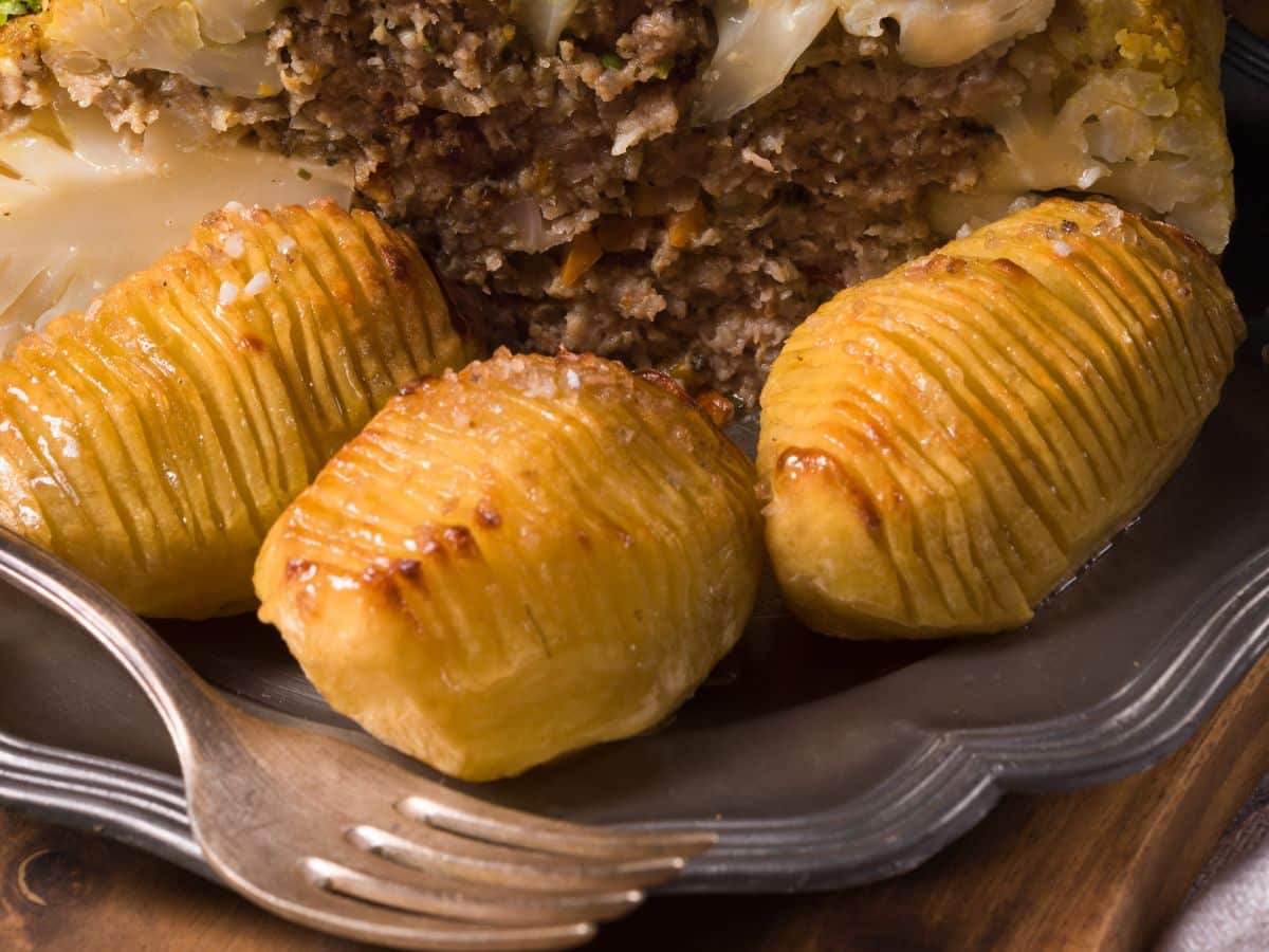 Peeled Hasselback Potatoes on a silver plate