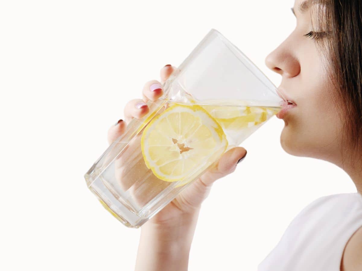 Woman Drinking Lemon Water