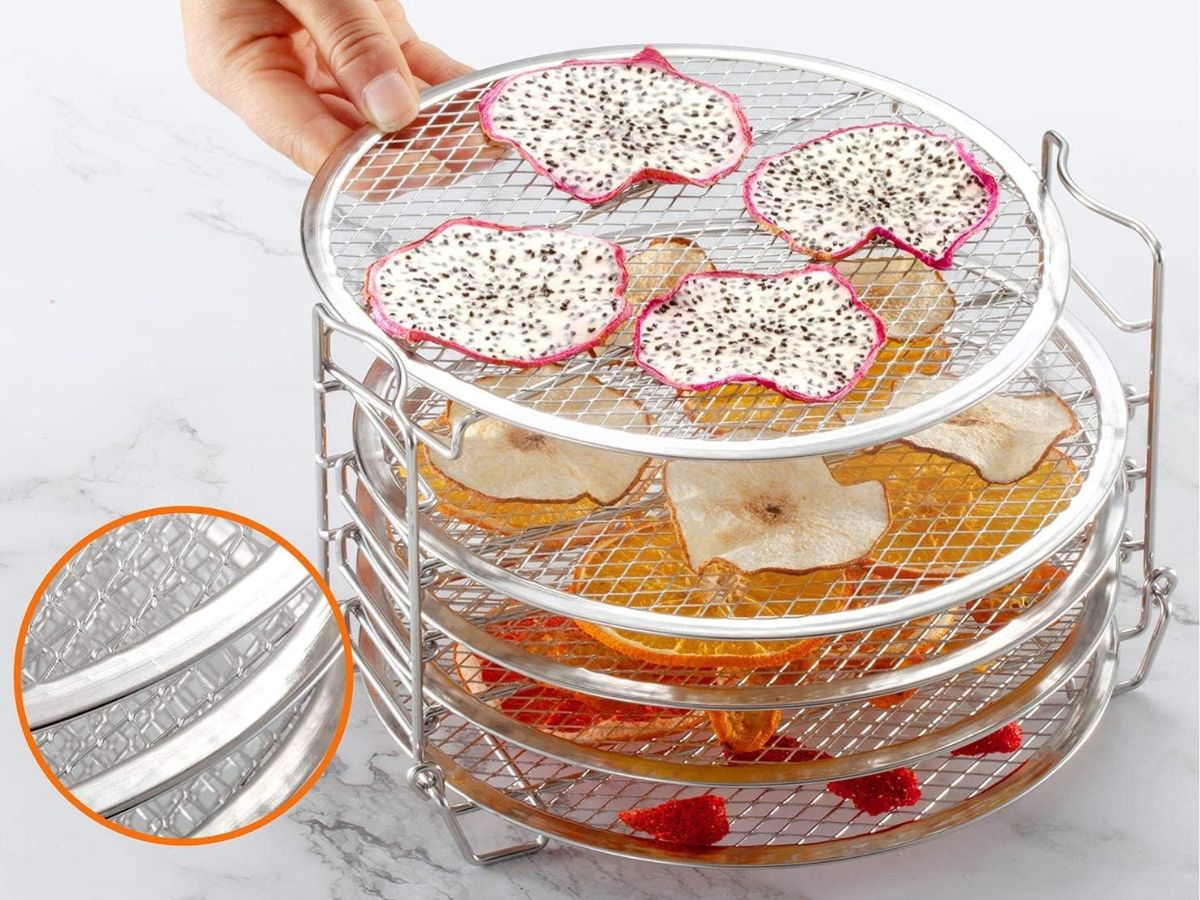 A dehydrator rack filled with fruit