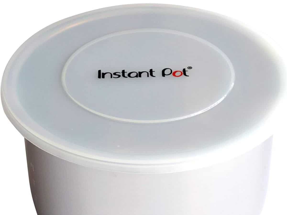 An Instant Pot insert with a silicone lid.