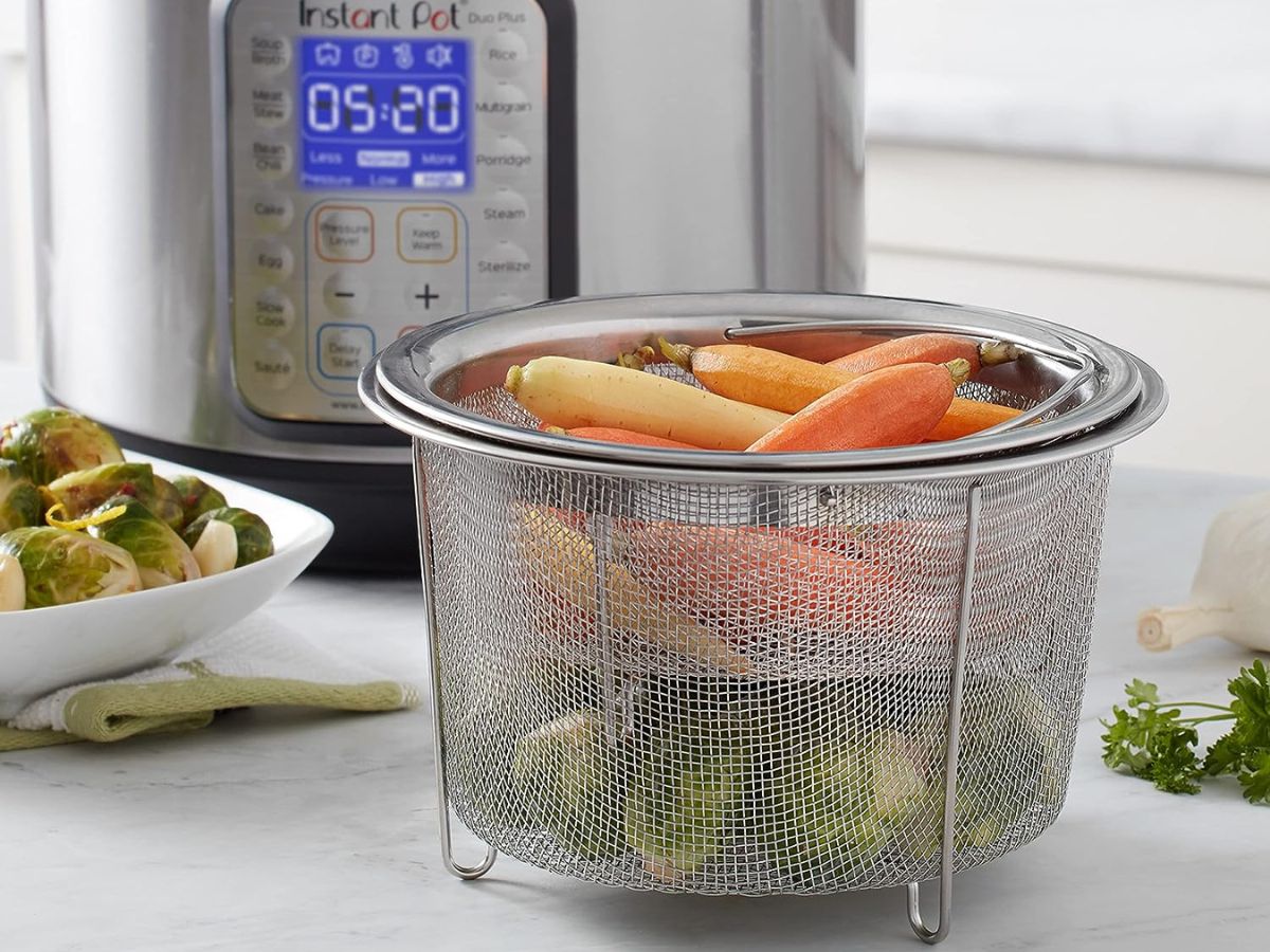 A mesh stainless steel steamer basket for an Instant Pot