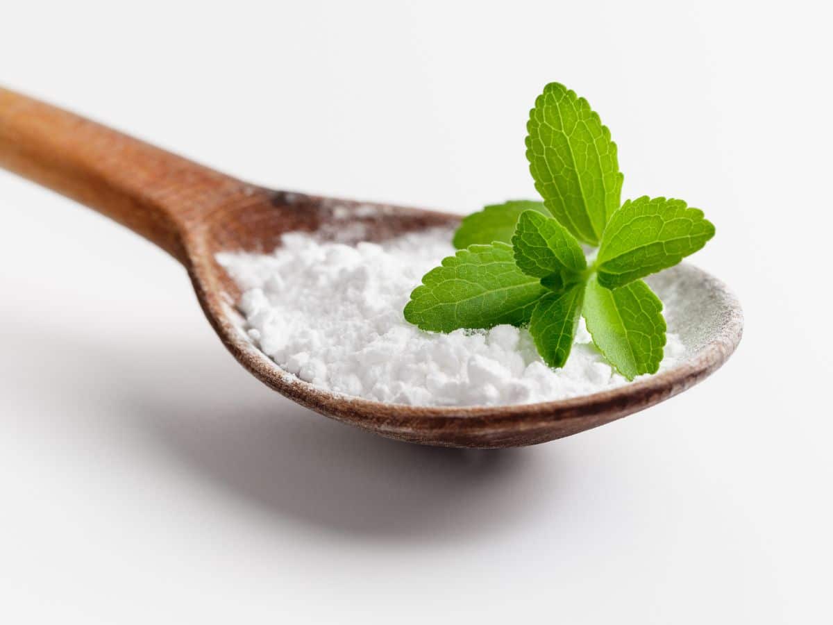 A wooden spoonful of stevia powder