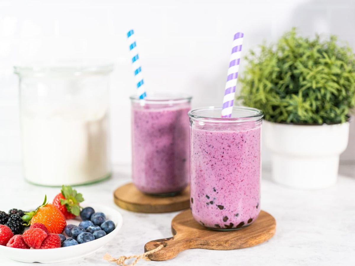 A smoothie with blueberries, strawberries and raspberries.