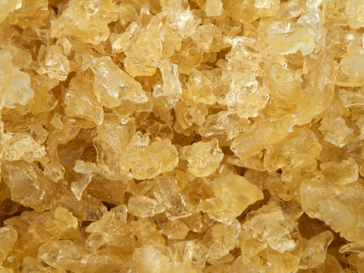 A close up image of a pile of yellow gelatin crystals.