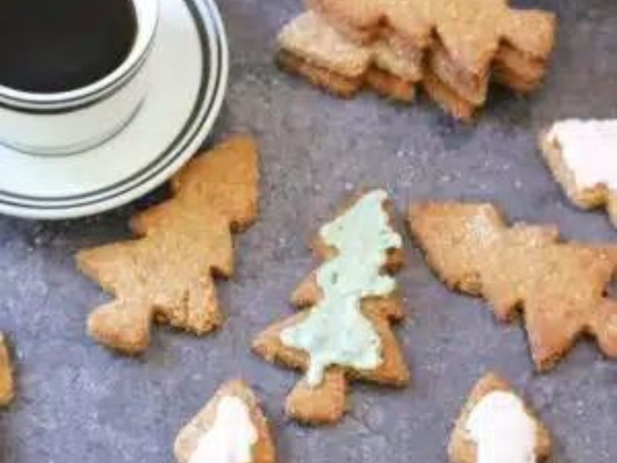 Gingerbread cookies with icing and a cup of coffee.