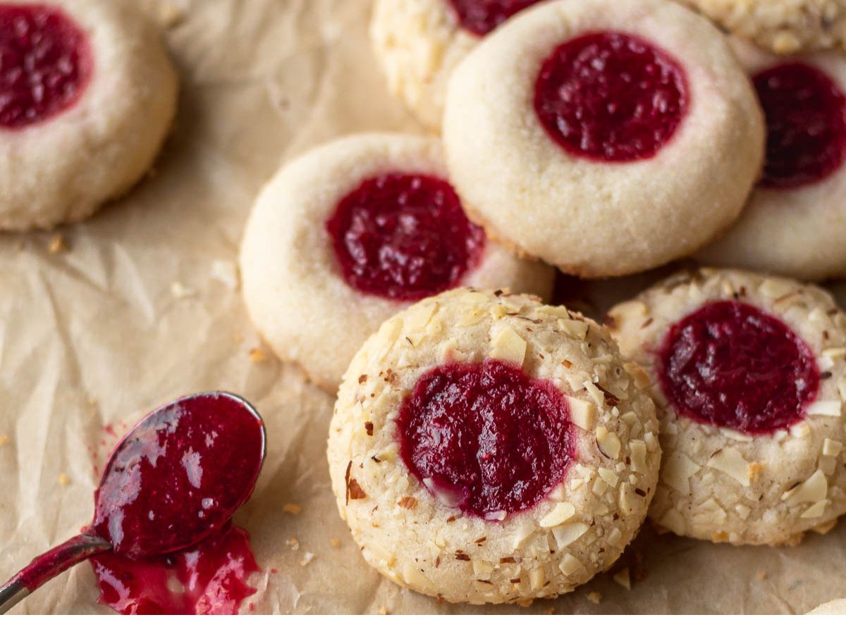 Cranberry almond cookies with a spoon.