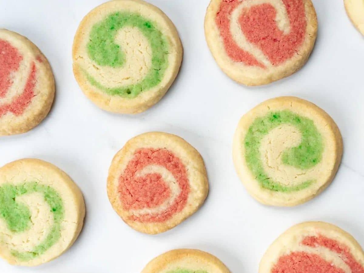 A group of cookies decorated with green, red, and white swirls.