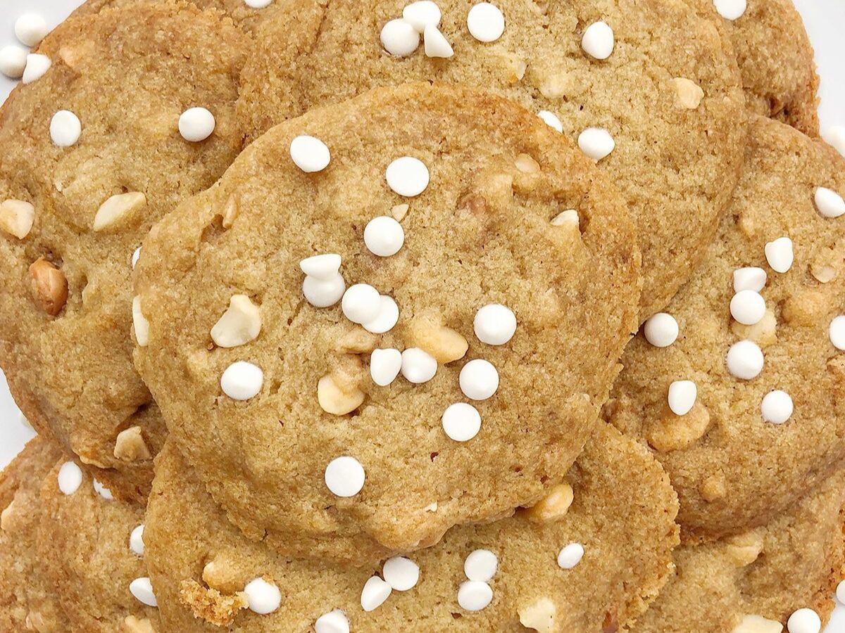 Peanut butter cookies with white sprinkles.