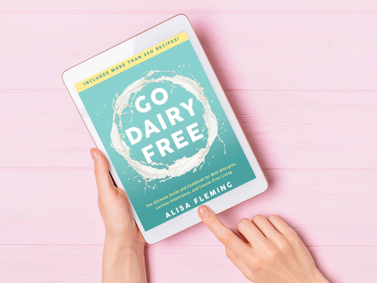 A woman looking at Go Dairy Free on a tablet.