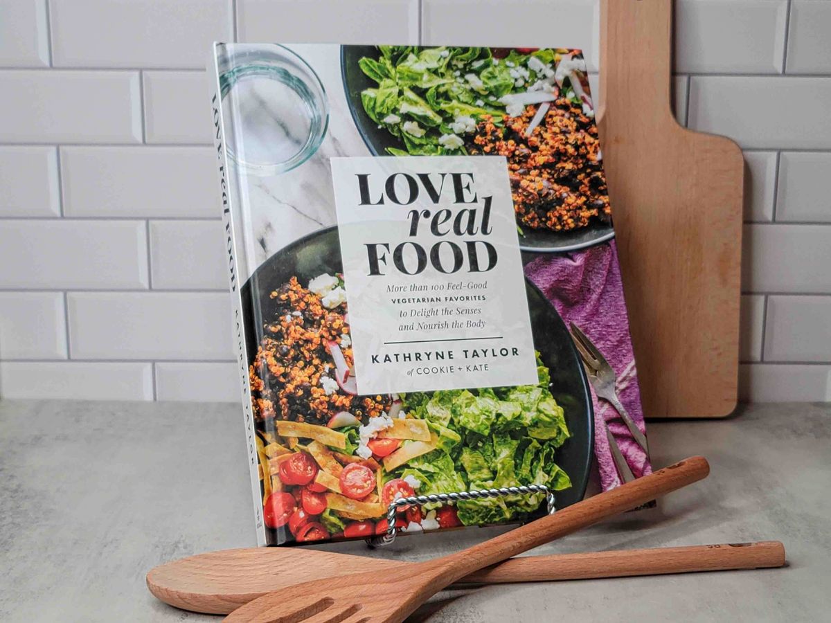 A copy of Love Real Food on a kitchen counter.