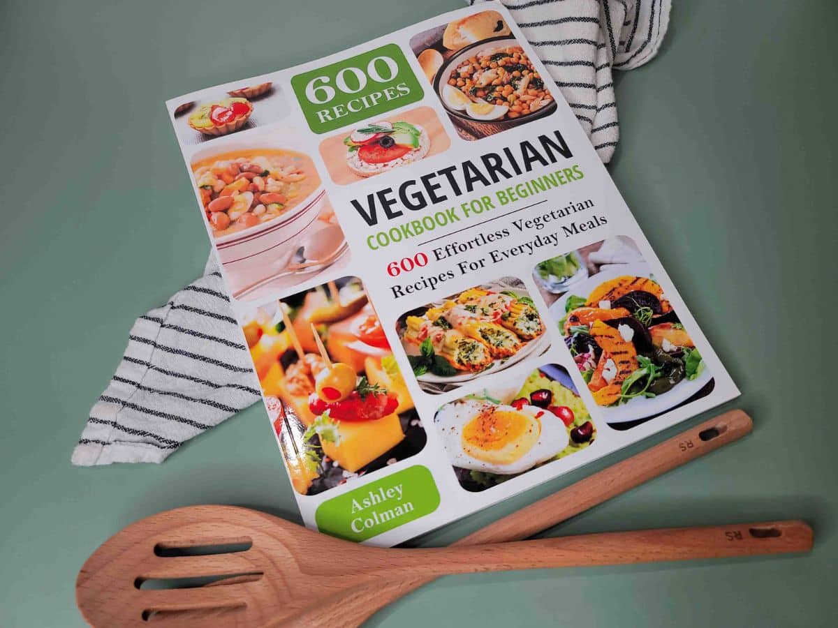 A copy of Vegetarian Cookbook for Beginners on a green background.