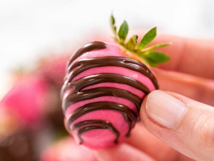 A delicious pink strawberry embellished with rich chocolate.