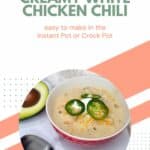 A bowl of creamy white chicken chili recipe garnished with cheese and jalapeños, presented as an easy option for instant pot or crock pot cooking.